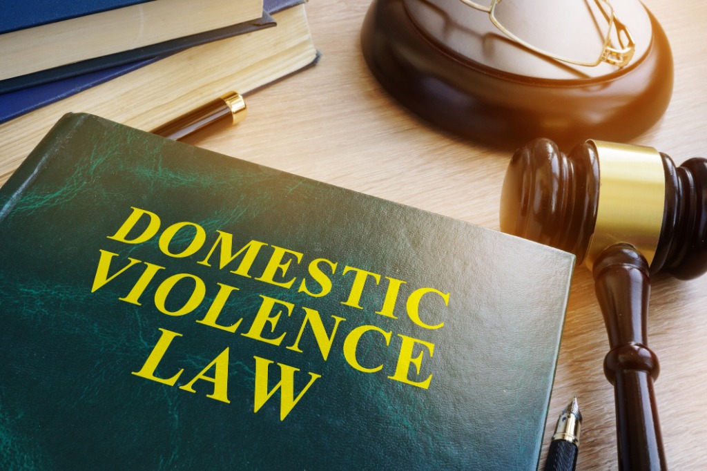Domestic violence law book and gavel &mdash; specialist investigative polygraph service for disputed domestic abuse allegations