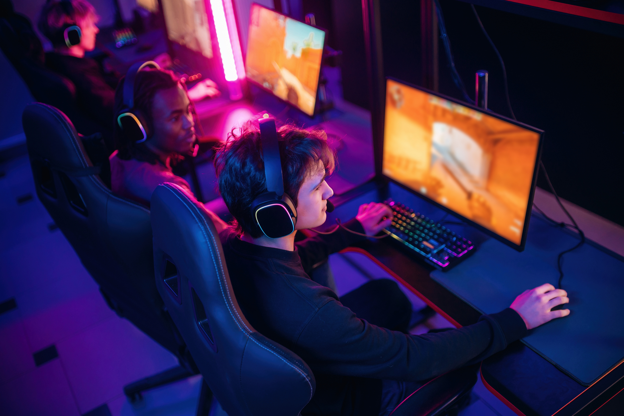 Esports participants competing at networked gaming stations; illustrative image, no CFN client is depicted